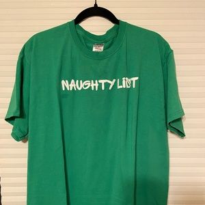 Custom green T-shirt that says “naughty list” with a matching sequin Santa hat